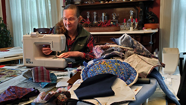 Cat White sewing coronavirus masks